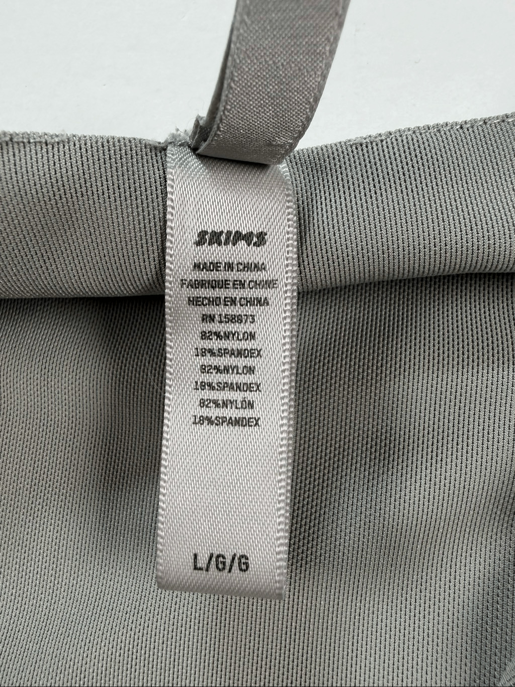 SKIMS Shine Zip Front Long Sleeve Bodysuit Gray Silver Metallic Size Large