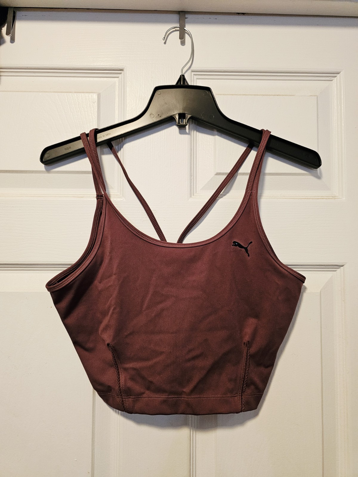 Burgundy Puma sports top women’s medium.