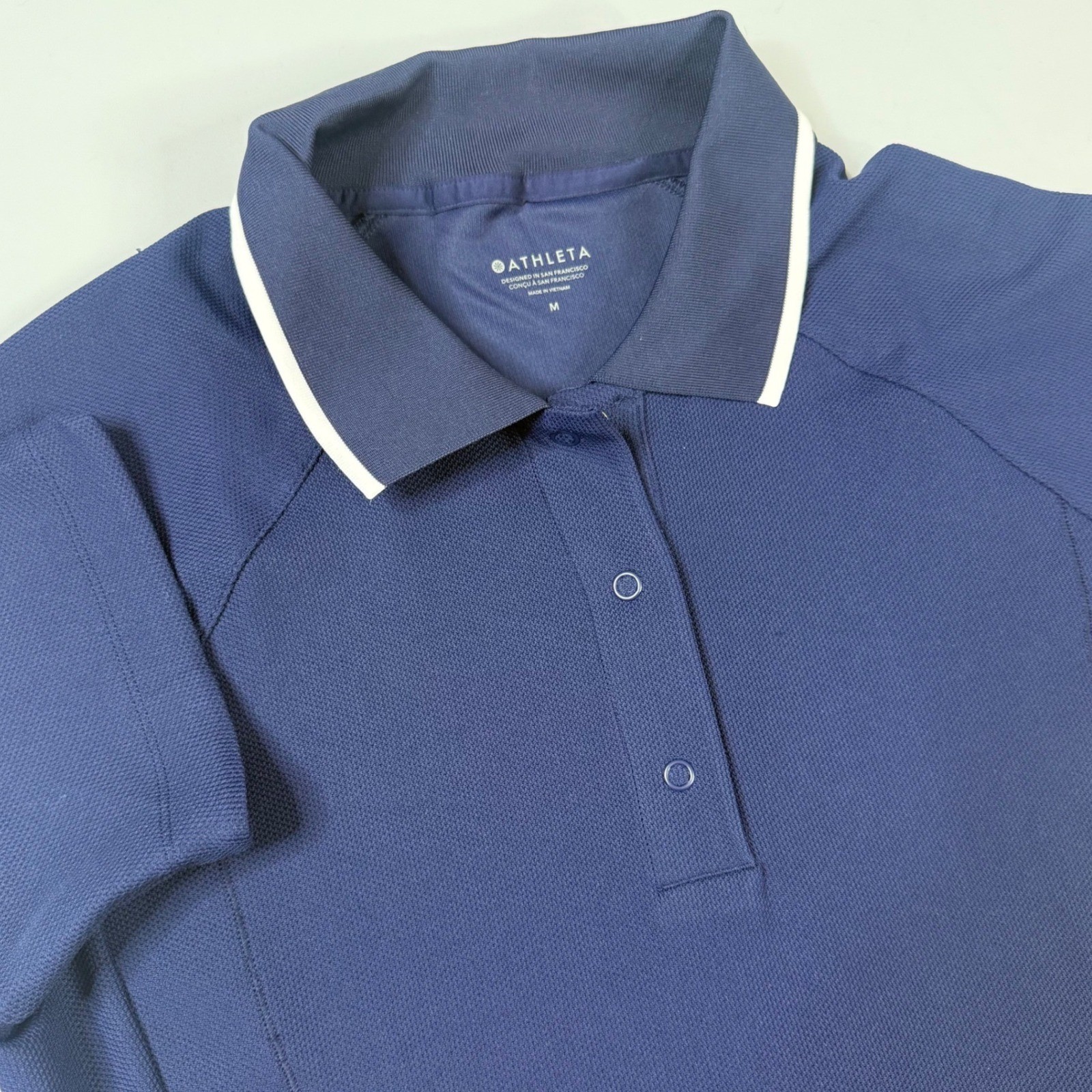 Athleta Everyday Polo Tee Women M Navy Blue Short Sleeve Snap Side Pocket Mesh