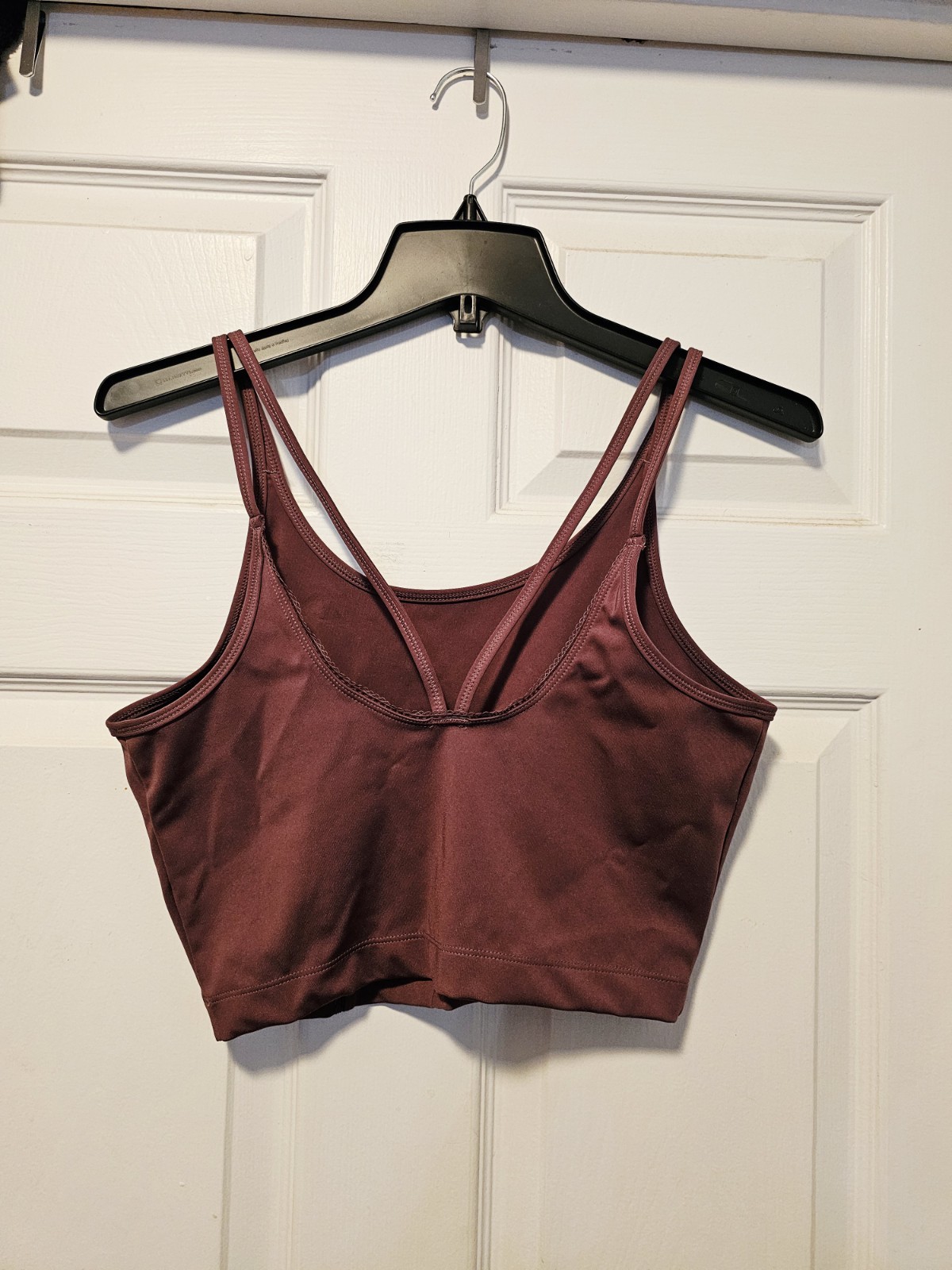 Burgundy Puma sports top women’s medium.