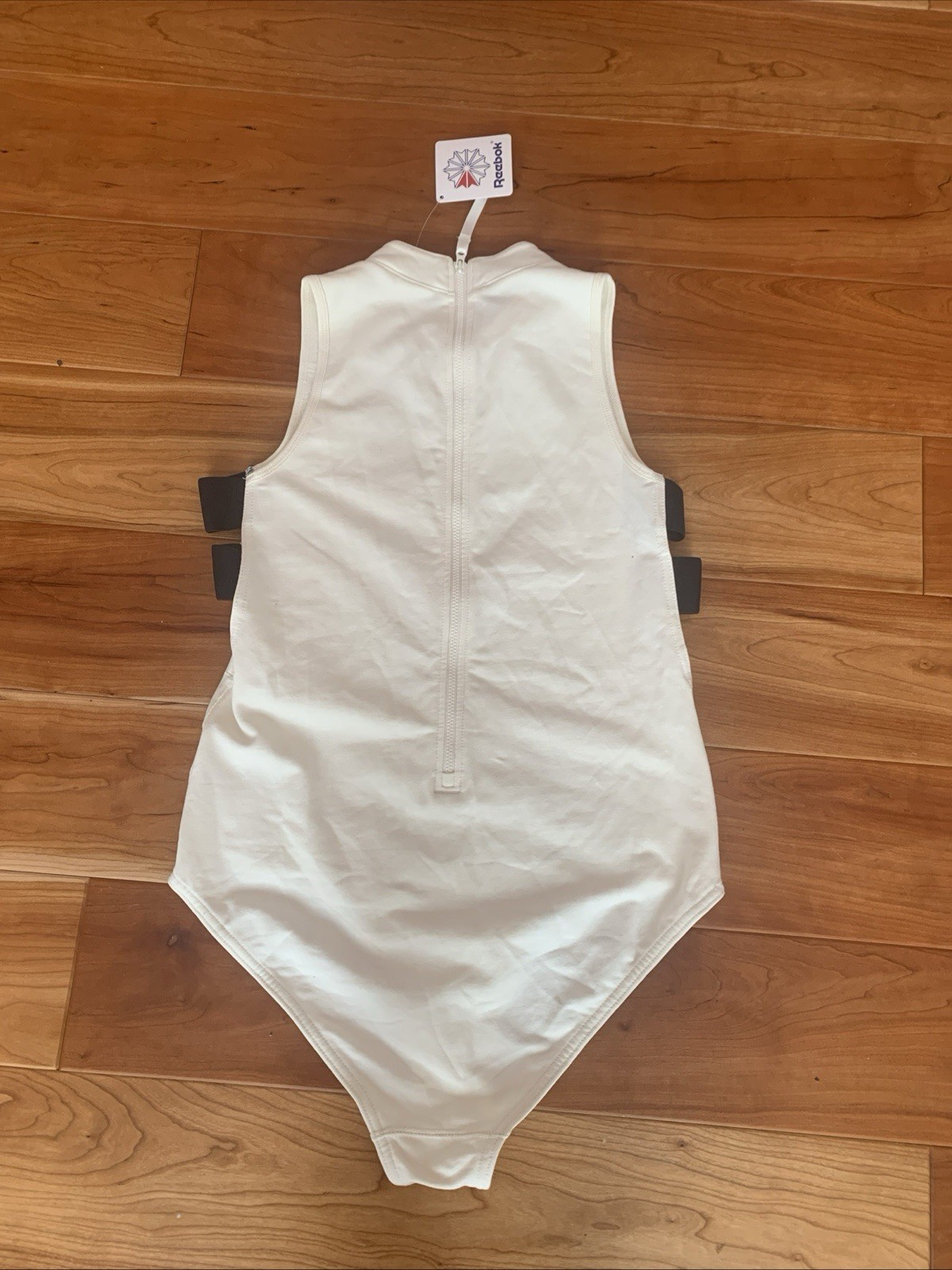 NWT Reebok Classic Womens Size Medium DC Bodysuit Cream With Black Accents
