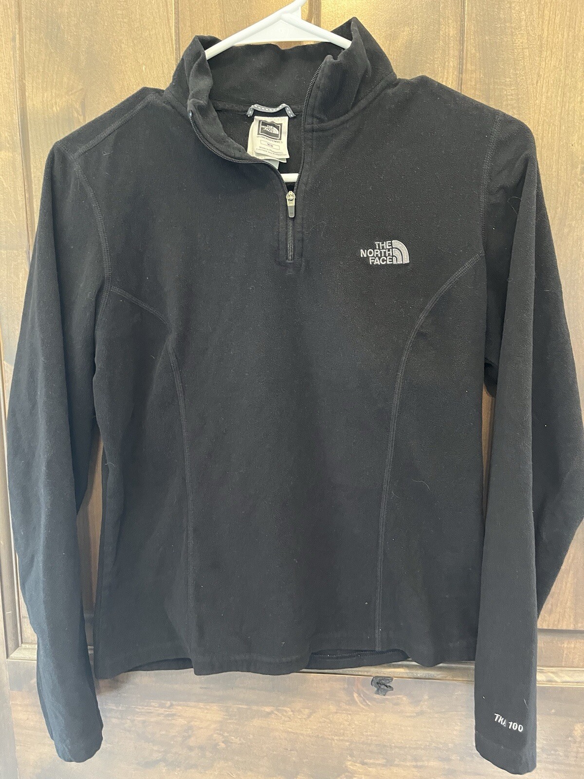 The North Face Womens Fleece black 1/4 zip pull over, Fitted Slim medium.