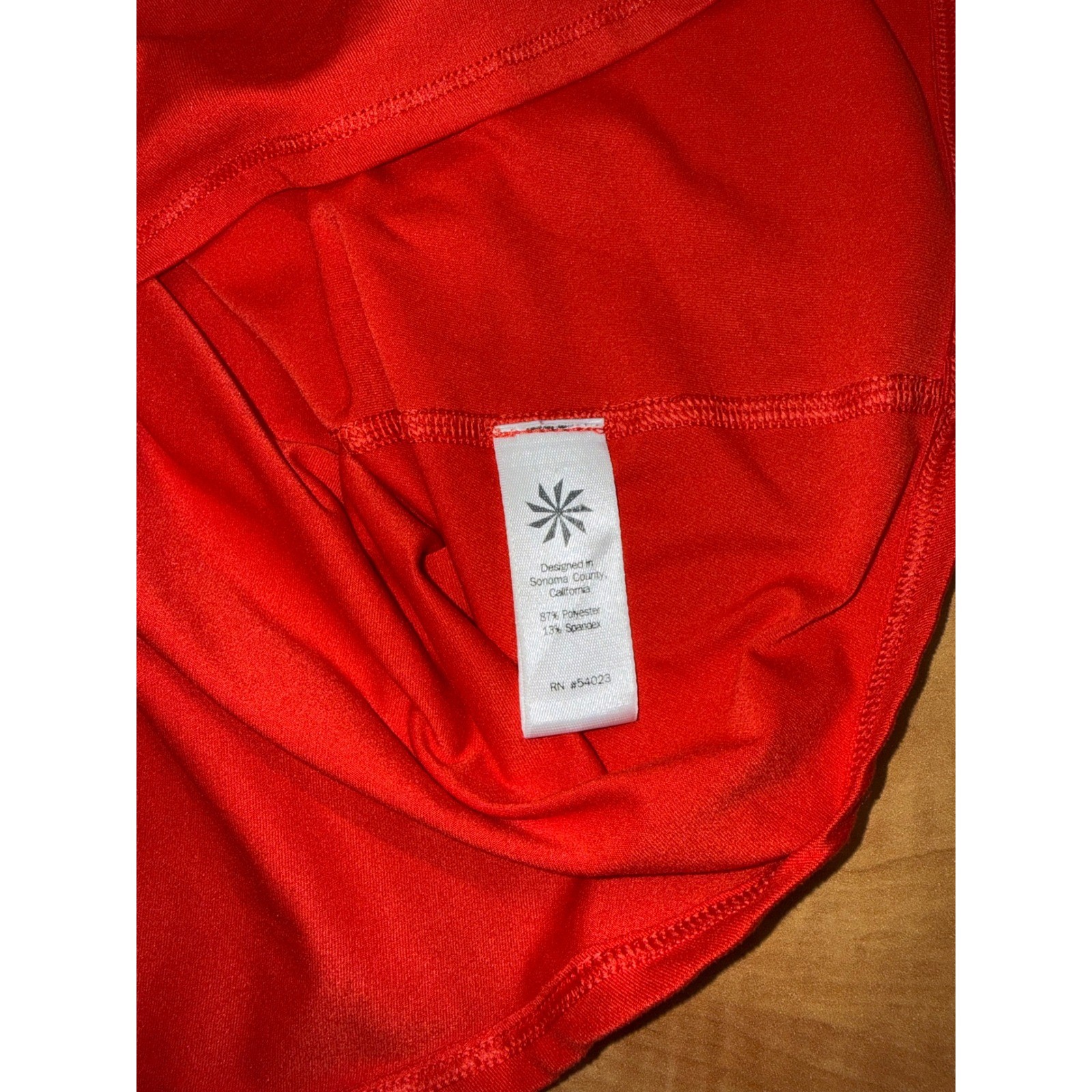 Athleta Womens Red Racerback Performance Tank Top Size S Scoop Neck Curved Hem